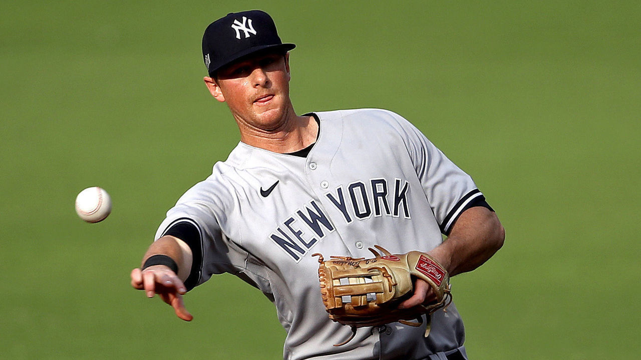 SAN DIEGO, CALIFORNIA - OCTOBER 09: DJ LeMahieu #26 of the New York Yankees throws out the runner against the Tampa Bay Rays during the first inning in Game Five of the American League Division Series at PETCO Park on October 09, 2020 in San Diego, California.