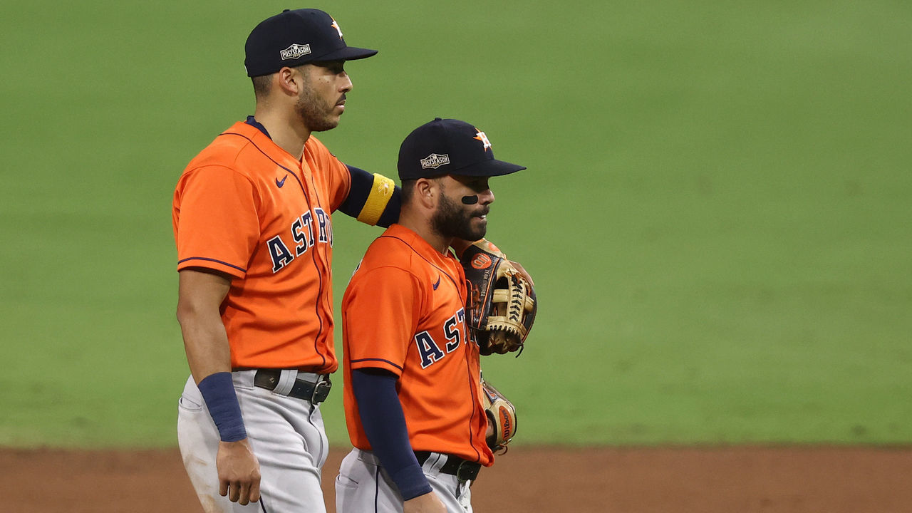 SAN DIEGO, CALIFORNIA - OCTOBER 16: Jose Altuve #27 and Carlos Correa #1 of the Houston Astros celebrate a 7-4 win against the Tampa Bay Rays in Game Six of the American League Championship Series at PETCO Park on October 16, 2020 in San Diego, California.