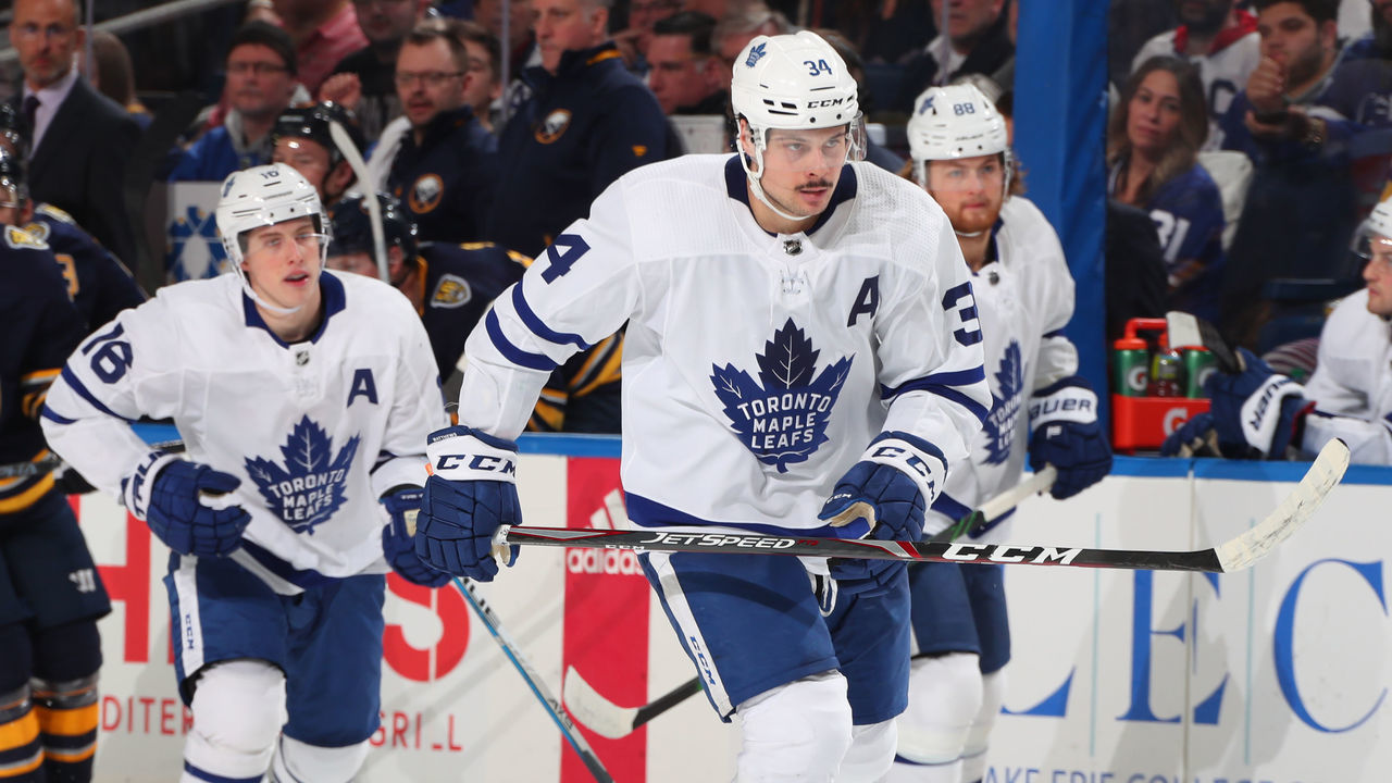 BUFFALO, NY - FEBRUARY 16: Mitchell Marner #16, Auston Matthews #34 and William Nylander #88 of the Toronto Maple Leafs skate during an NHL game against the Buffalo Sabres on February 16, 2020 at KeyBank Center in Buffalo, New York.