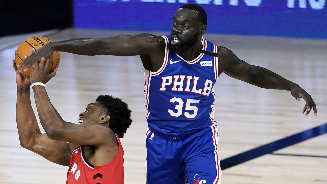 LAKE BUENA VISTA, FLORIDA - AUGUST 12: Stanley Johnson #5 of the Toronto Raptors tries to shoot as Marial Shayok #35 of the Philadelphia 76ers defends during the second half at The Field House at ESPN Wide World Of Sports Complex on August 12, 2020 in Lake Buena Vista, Florida.