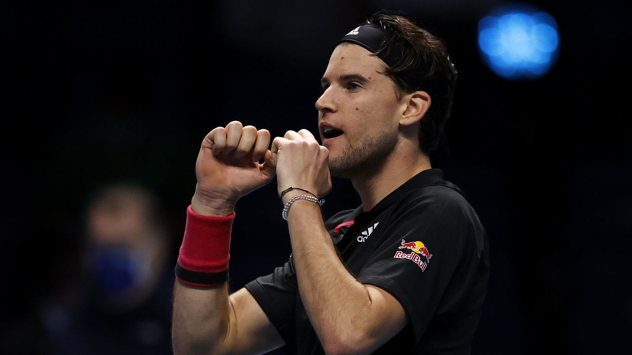 LONDON, ENGLAND - NOVEMBER 21: Dominic Thiem of Austria celebrates winning match point during his singles semi final match against Novak Djokovic of Serbia during day seven of the Nitto ATP World Tour Finals at The O2 Arena on November 21, 2020 in London, England.