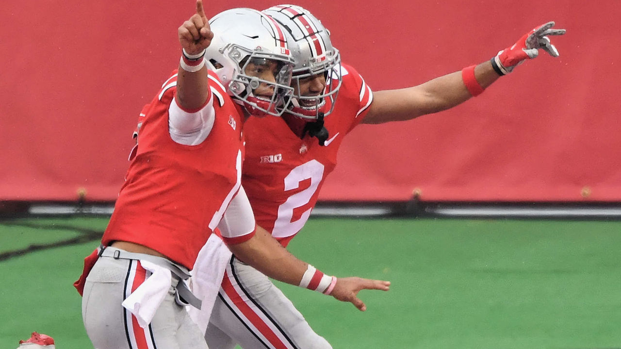COLUMBUS, OH - NOVEMBER 21: Quarterback Justin Fields #1 of the Ohio State Buckeyes, left, celebrates with Chris Olave #2 of the Ohio State Buckeyes after scoring on a nine-yard touchdown run in the second quarter against the Indiana Hoosiers at Ohio Stadium on November 21, 2020 in Columbus, Ohio.