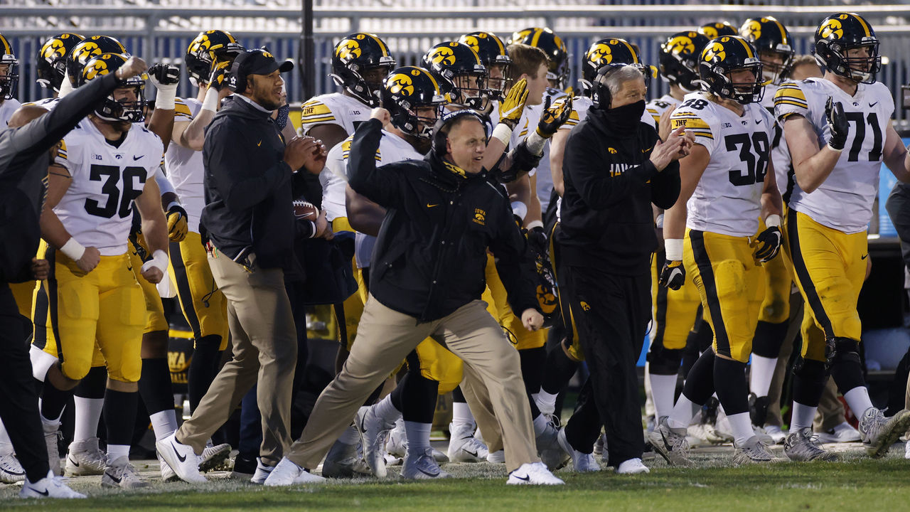 STATE COLLEGE, PA - NOVEMBER 21: Head coach Kirk Ferentz of the Iowa Hawkeyes reacts from the sideline with players and coaches after a fourth down defensive stop against the Penn State Nittany Lions in the second quarter of the game at Beaver Stadium on November 21, 2020 in State College, Pennsylvania.