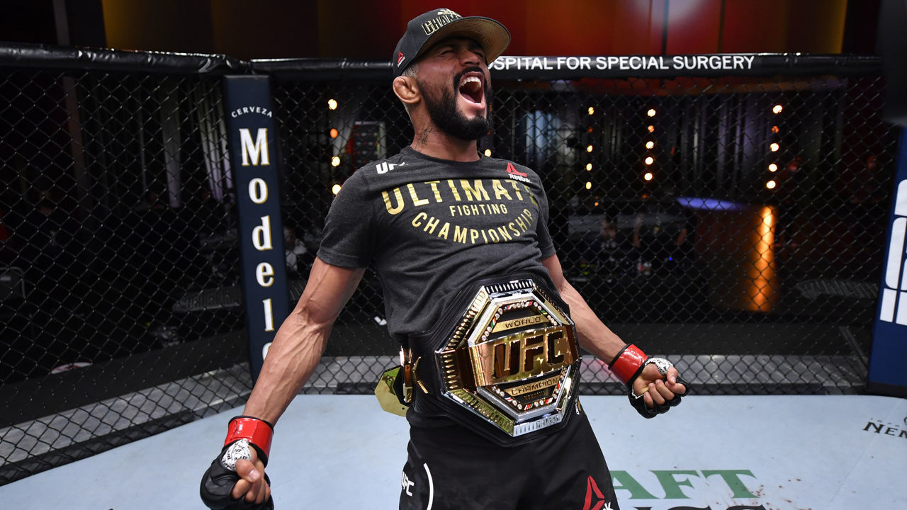 LAS VEGAS, NEVADA - NOVEMBER 21: Deiveson Figueiredo of Brazil celebrates his submission victory over Alex Perez in their flyweight championship bout during the UFC 255 event at UFC APEX on November 21, 2020 in Las Vegas, Nevada.