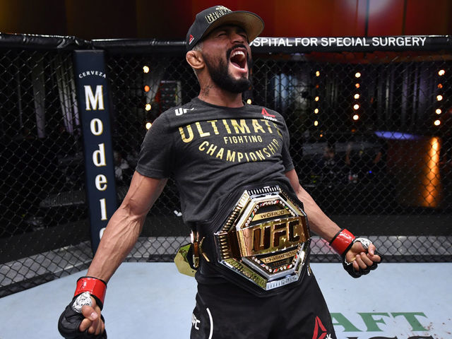 LAS VEGAS, NEVADA - NOVEMBER 21: Deiveson Figueiredo of Brazil celebrates his submission victory over Alex Perez in their flyweight championship bout during the UFC 255 event at UFC APEX on November 21, 2020 in Las Vegas, Nevada.