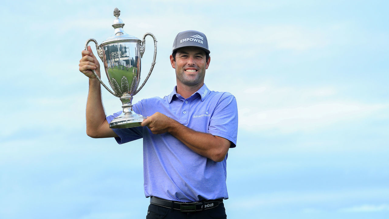 ST SIMONS ISLAND, GEORGIA - NOVEMBER 22: Robert Streb of the United States celebrates with the trophy after winning in a sudden-death playoff against Kevin Kisner (not pictured) during the final round of The RSM Classic at the Seaside Course at Sea Island Golf Club on November 22, 2020 in St Simons Island, Georgia.