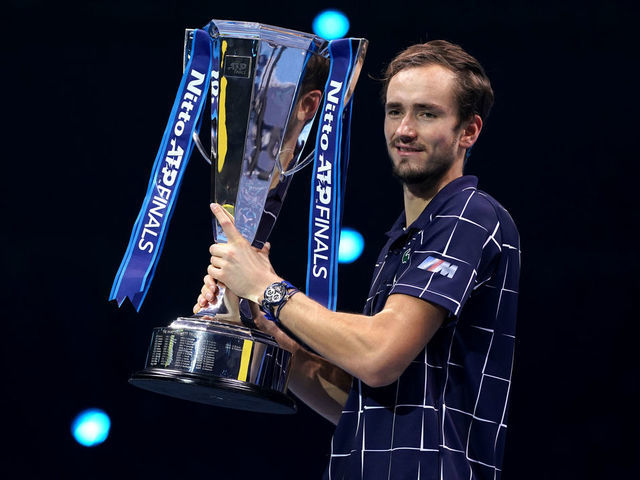 Daniil Medvedev of Russia, right, poses after winning the final