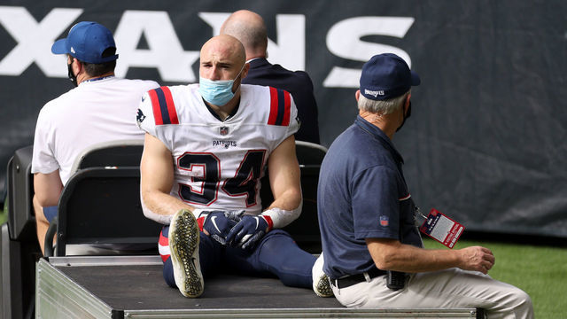 HOUSTON, TEXAS - NOVEMBER 22: Rex Burkhead #34 of the New England Patriots is carted off the field following an injury in the third quarter during their game against the Houston Texans at NRG Stadium on November 22, 2020 in Houston, Texas.