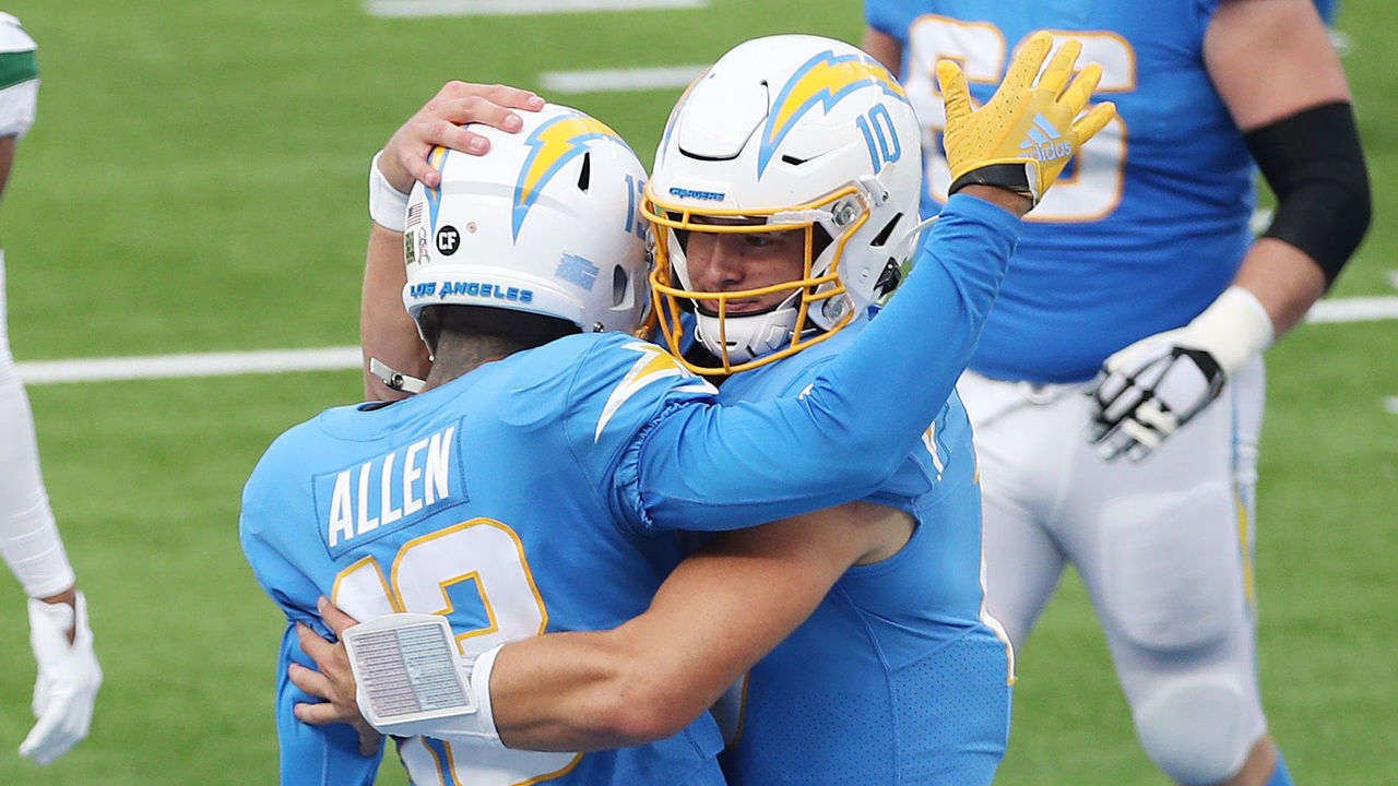 INGLEWOOD, CALIFORNIA - NOVEMBER 22: Justin Herbert #10 celebrates a touchdown with Keenan Allen #13 of the Los Angeles Chargers during the first half against the New York Jets at SoFi Stadium on November 22, 2020 in Inglewood, California.