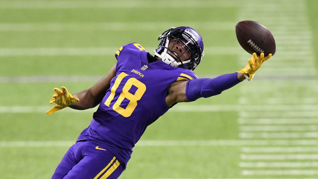 MINNEAPOLIS, MINNESOTA - NOVEMBER 22: Justin Jefferson #18 of the Minnesota Vikings attempts to catch a pass during their game against the Dallas Cowboys at U.S. Bank Stadium on November 22, 2020 in Minneapolis, Minnesota.