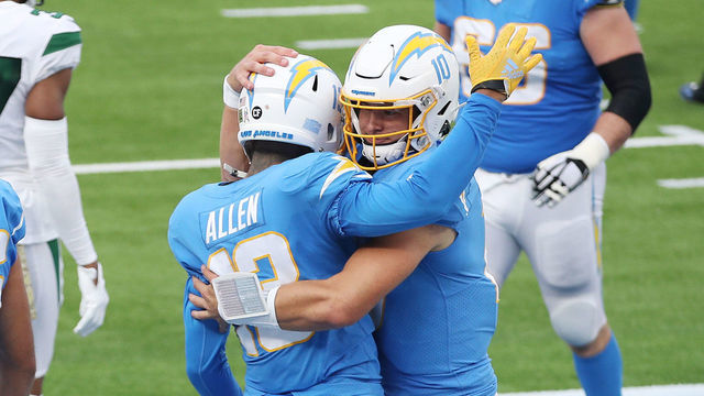 INGLEWOOD, CALIFORNIA - NOVEMBER 22: Justin Herbert #10 celebrates a touchdown with Keenan Allen #13 of the Los Angeles Chargers during the first half against the New York Jets at SoFi Stadium on November 22, 2020 in Inglewood, California.