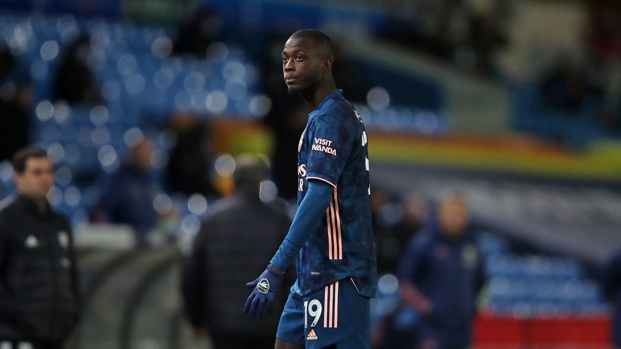 Arsenal's French-born Ivorian midfielder Nicolas Pepe leaves the pitch after being sent off after clashing with Leeds United's Macedonian midfielder Ezgjan Alioski during the English Premier League football match between Leeds United and Arsenal at Elland Road in Leeds, northern England on November 22, 2020.