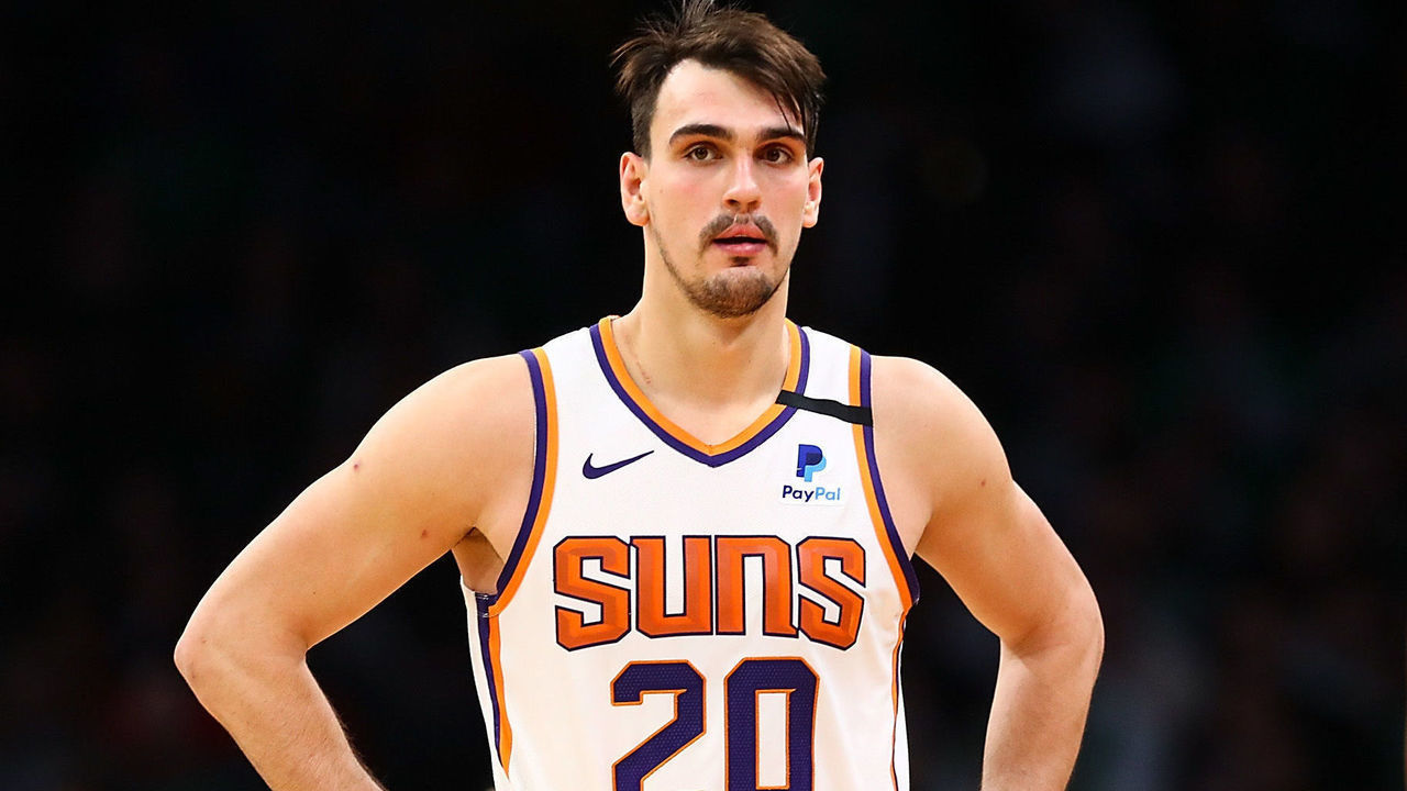 BOSTON, MA - JANUARY 18: Deandre Ayton #22, Dario Saric #20 and Mikal Bridges #25 of the Phoenix Suns look on during a game against the Boston Celtics at TD Garden on January 18, 2020 in Boston, Massachusetts.