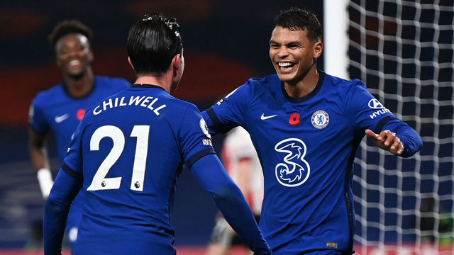 LONDON, ENGLAND - NOVEMBER 07: Thiago Silva of Chelsea celebrates with teammate Ben Chilwell after scoring his team's third goal during the Premier League match between Chelsea and Sheffield United at Stamford Bridge on November 07, 2020 in London, England. Sporting stadiums around the UK remain under strict restrictions due to the Coronavirus Pandemic as Government social distancing laws prohibit fans inside venues resulting in games being played behind closed doors.