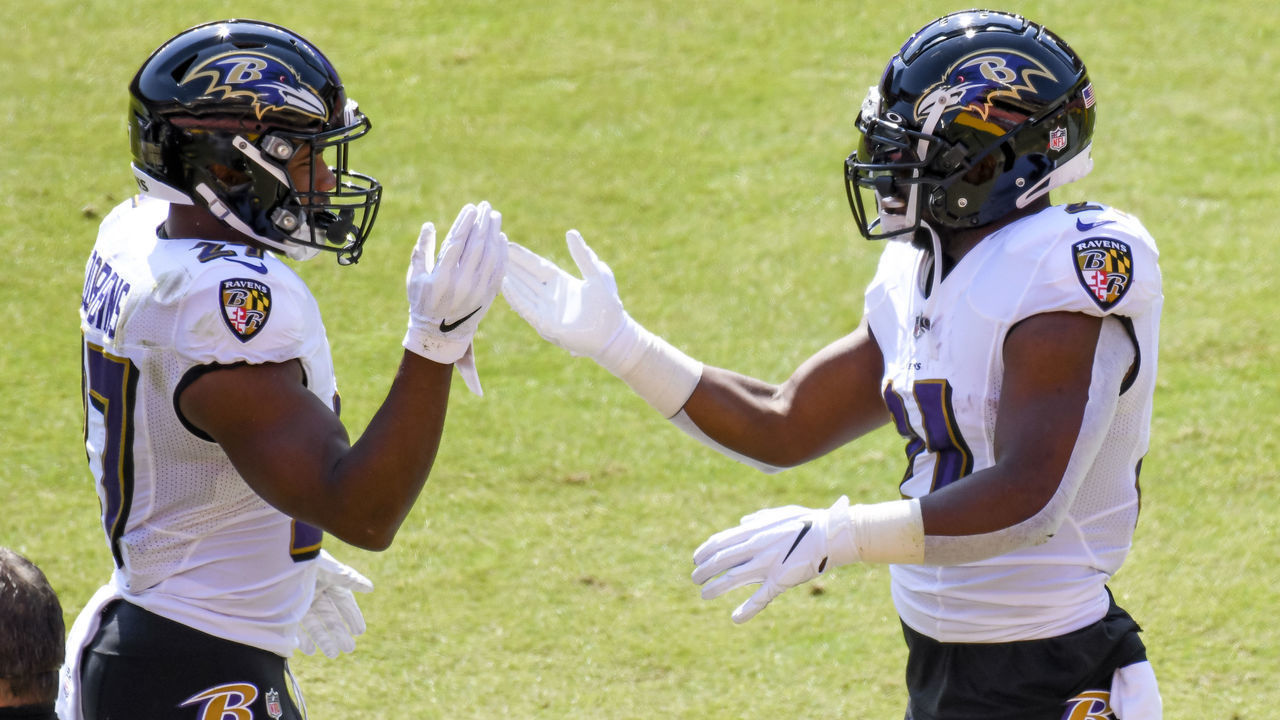 LANDOVER, MD - OCTOBER 04: Baltimore Ravens running back Mark Ingram (21) is congratulated by running back J.K. Dobbins (27) after running for a touchdown in the first quarter during the Baltimore Ravens game versus the Washington Football Team on October 4, 2020 at FedEx Field in in Landover, MD.