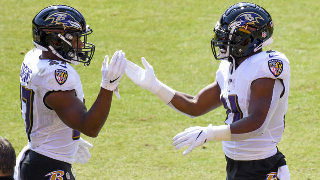LANDOVER, MD - OCTOBER 04: Baltimore Ravens running back Mark Ingram (21) is congratulated by running back J.K. Dobbins (27) after running for a touchdown in the first quarter during the Baltimore Ravens game versus the Washington Football Team on October 4, 2020 at FedEx Field in in Landover, MD.
