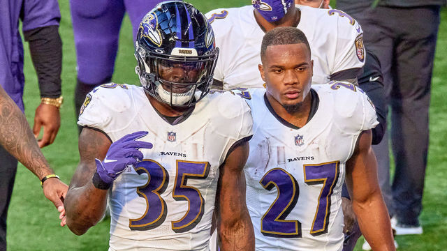 INDIANAPOLIS, IN - NOVEMBER 08: Baltimore Ravens running back Gus Edwards (35) and Baltimore Ravens running back J.K. Dobbins (27) look on in action during a NFL game between the Indianapolis Colts and the Baltimore Ravens on November 08, 2020 at Lucas Oil Stadium in Indianapolis, IN.