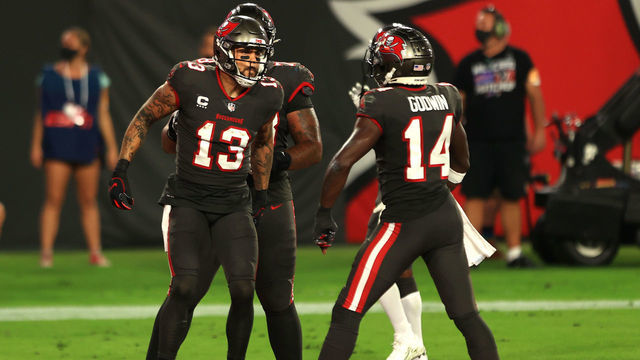 TAMPA, FLORIDA - NOVEMBER 23: Mike Evans #13 of the Tampa Bay Buccaneers celebrates alongside Chris Godwin #14 after scoring a nine-yard touchdown against the Los Angeles Rams during the first quarter in the game at Raymond James Stadium on November 23, 2020 in Tampa, Florida.
