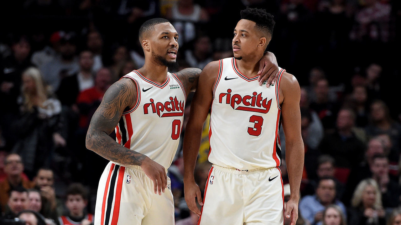 PORTLAND, OREGON - DECEMBER 06: Damian Lillard #0 of the Portland Trail Blazers tries to speak with CJ McCollum #3 after McCollum drew a technical foul during the second half of the game against the Los Angeles Lakers at Moda Center on December 06, 2019 in Portland, Oregon. The Lakers won 136-113.
