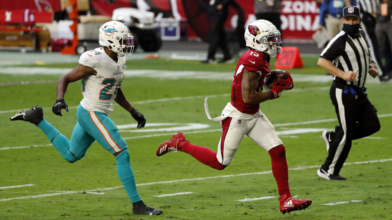 GLENDALE, ARIZONA - NOVEMBER 08: Wide receiver Christian Kirk #13 of the Arizona Cardinals runs past cornerback Byron Jones #24 of the Miami Dolphins during the first half of the NFL game at State Farm Stadium on November 08, 2020 in Glendale, Arizona.
