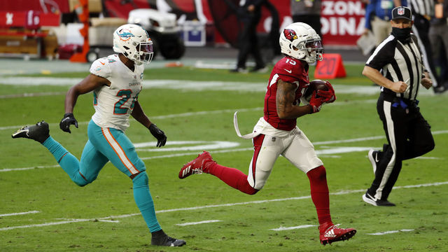 GLENDALE, ARIZONA - NOVEMBER 08: Wide receiver Christian Kirk #13 of the Arizona Cardinals runs past cornerback Byron Jones #24 of the Miami Dolphins during the first half of the NFL game at State Farm Stadium on November 08, 2020 in Glendale, Arizona.