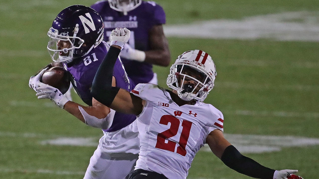 EVANSTON, ILLINOIS - NOVEMBER 21: Ramaud Chiaokhiao-Bowman #81 of the Northwestern Wildcats moves around Caesar Williams #21 of the Wisconsin Badgers after catching a first down pass at Ryan Field on November 21, 2020 in Evanston, Illinois. Northwestern defeated Wisconsin 17-7.