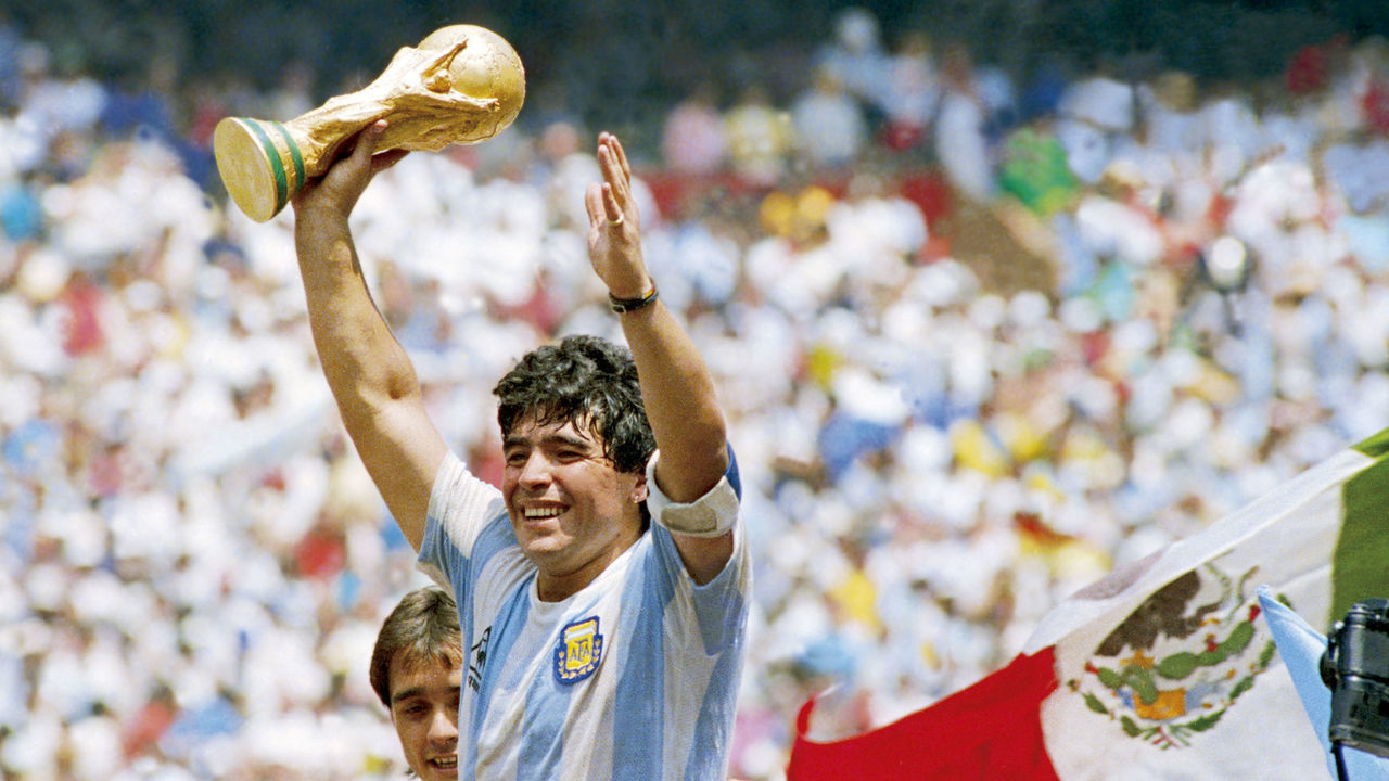 MEXICO CITY, MEXICO - JUNE 29: Diego Maradona of Argentina holds the World Cup trophy after defeating West Germany 3-2 during the 1986 FIFA World Cup Final match at the Azteca Stadium on June 29, 1986 in Mexico City, Mexico.