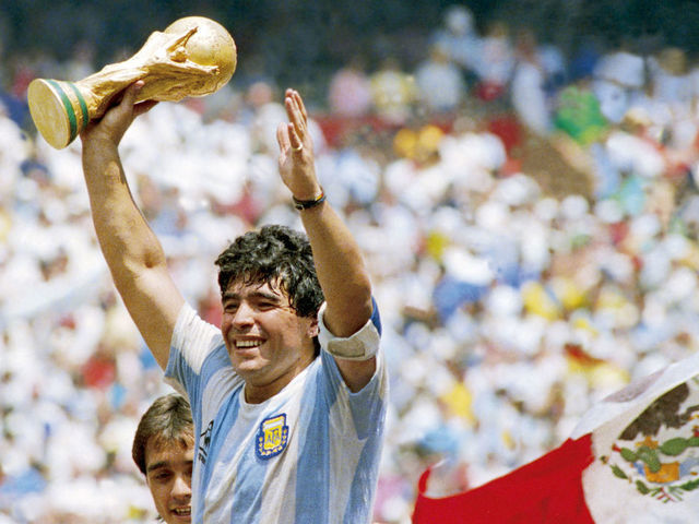 MEXICO CITY, MEXICO - JUNE 29: Diego Maradona of Argentina holds the World Cup trophy after defeating West Germany 3-2 during the 1986 FIFA World Cup Final match at the Azteca Stadium on June 29, 1986 in Mexico City, Mexico.