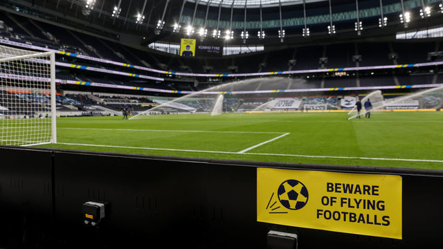 LONDON, ENGLAND - OCTOBER 18: A beware of flying footballs sign is seen pitch side ahead of the Premier League match between Tottenham Hotspur and West Ham United at Tottenham Hotspur Stadium on October 18, 2020 in London, United Kingdom. Sporting stadiums around the UK remain under strict restrictions due to the Coronavirus Pandemic as Government social distancing laws prohibit fans inside venues resulting in games being played behind closed doors.