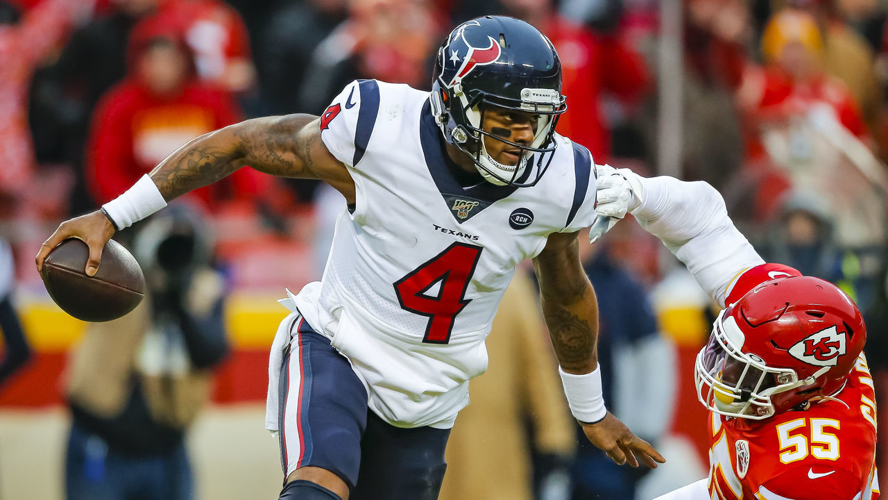 KANSAS CITY, MO - JANUARY 12: Deshaun Watson #4 of the Houston Texans escapes pressure from Frank Clark #55 of the Kansas City Chiefs during the third quarter of the AFC Divisional playoff game at Arrowhead Stadium on January 12, 2020 in Kansas City, Missouri.
