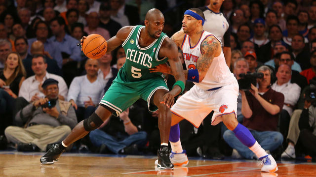 NEW YORK, NY - APRIL 23: Kevin Garnett #5 of the Boston Celtics dribbles against Kenyon Martin #3 of the New York Knicks during Game two of the Eastern Conference Quarterfinals of the 2013 NBA Playoffs at Madison Square Garden on April 23, 2013 in New York City.