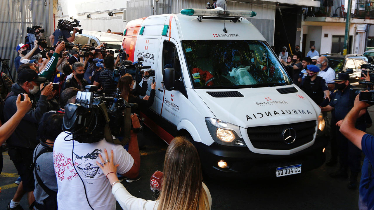 VICENTE LOPEZ, ARGENTINA - NOVEMBER 11: The ambulance carrying Diego Maradona drives among the media leaving Clinica Olivos on November 11, 2020 in Vicente Lopez, Argentina.