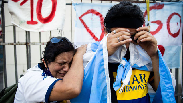 BUENOS AIRES, ARGENTINA - NOVEMBER 26: Fans cry for Diego Maradona after the news of his decease on November 26, 2020 in Buenos Aires, Argentina. Diego Maradona, considered one of the biggest football stars in history, died at 60 from a heart attack on Wednesday in Buenos Aires.