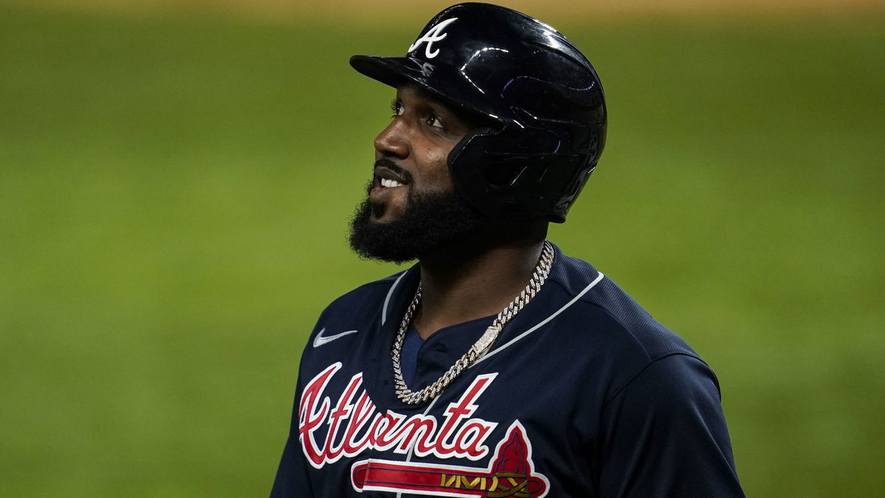ARLINGTON, TX - OCTOBER 18: Marcell Ozuna #20 of the Atlanta Braves walks to the dugout after being robbed of a home run during Game 7 of the NLCS between the Atlanta Braves and the Los Angeles Dodgers at Globe Life Field on Sunday, October 18, 2020 in Arlington, Texas.