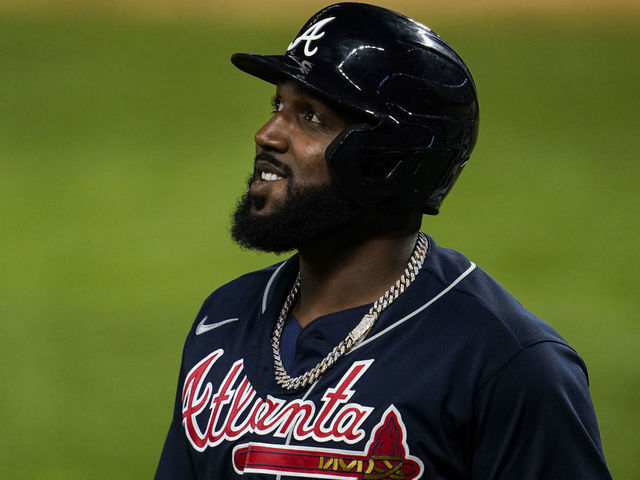 ARLINGTON, TX - OCTOBER 18: Marcell Ozuna #20 of the Atlanta Braves walks to the dugout after being robbed of a home run during Game 7 of the NLCS between the Atlanta Braves and the Los Angeles Dodgers at Globe Life Field on Sunday, October 18, 2020 in Arlington, Texas.