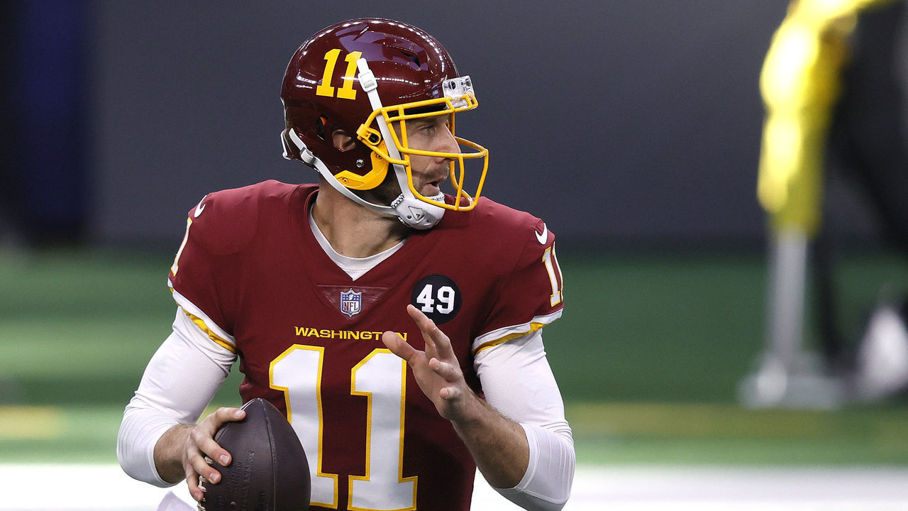 ARLINGTON, TEXAS - NOVEMBER 26: Alex Smith #11 of the Washington Football Team looks to pass during the first quarter of a game against the Dallas Cowboys at AT&T Stadium on November 26, 2020 in Arlington, Texas.