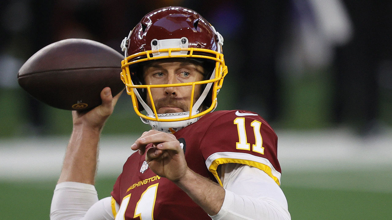 ARLINGTON, TEXAS - NOVEMBER 26: Alex Smith #11 of the Washington Football Team looks to pass during the second quarter of a game against the Dallas Cowboys at AT&T Stadium on November 26, 2020 in Arlington, Texas.
