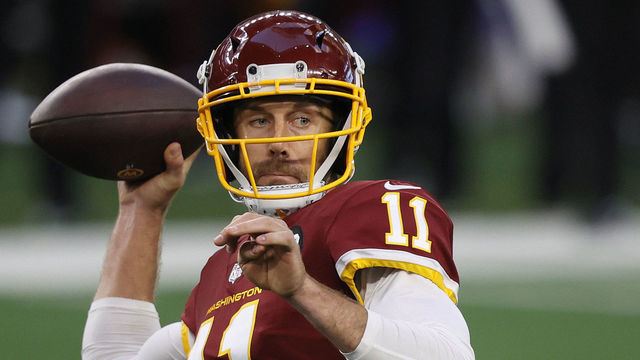 ARLINGTON, TEXAS - NOVEMBER 26: Alex Smith #11 of the Washington Football Team looks to pass during the second quarter of a game against the Dallas Cowboys at AT&T Stadium on November 26, 2020 in Arlington, Texas.