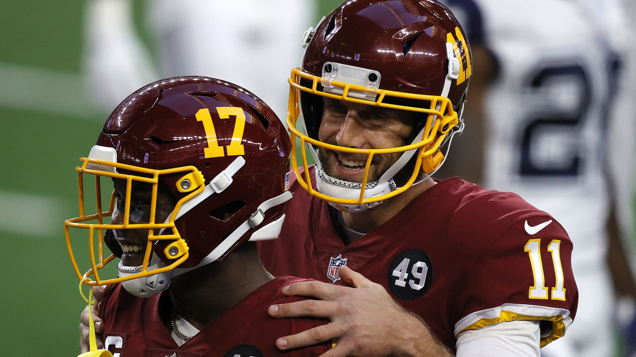 ARLINGTON, TEXAS - NOVEMBER 26: Alex Smith #11 of the Washington Football Team reacts alongside Terry McLaurin #17 during the second quarter of a game against the Dallas Cowboys at AT&T Stadium on November 26, 2020 in Arlington, Texas.