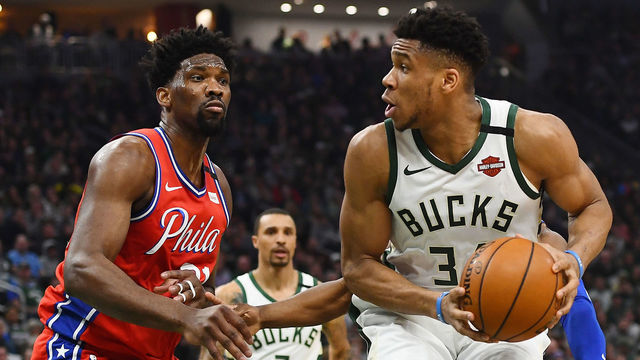 MILWAUKEE, WISCONSIN - FEBRUARY 22: Giannis Antetokounmpo #34 of the Milwaukee Bucks is defended by Joel Embiid #21 of the Philadelphia 76ers during a game at Fiserv Forum on February 22, 2020 in Milwaukee, Wisconsin.