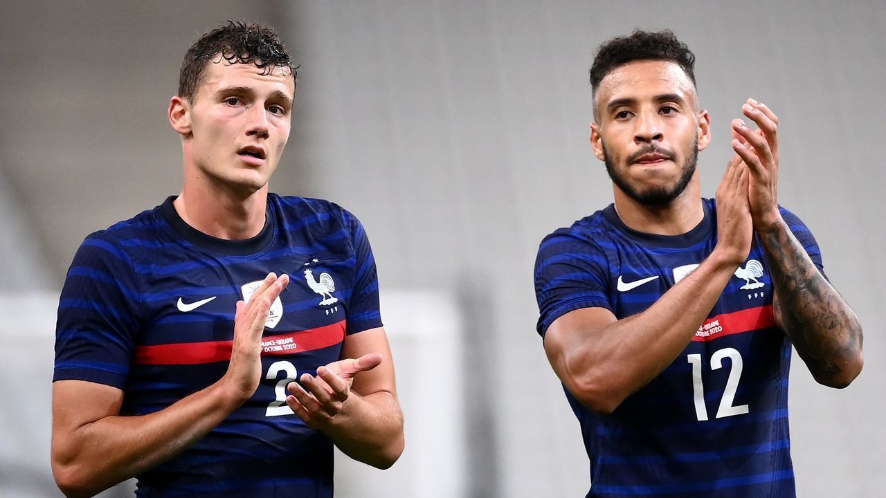 France's defender Benjamin Pavard (L) and midfielder Corentin Tolisso (R) aknowledge the audience at the end of the International friendly football match between France and Ukraine on October 7, 2020 at the Stade de France in Saint-Denis, outside Paris.