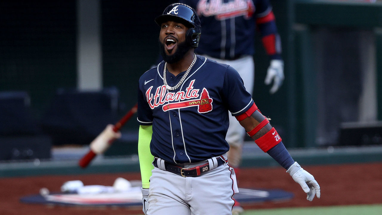 ARLINGTON, TEXAS - OCTOBER 17: Marcell Ozuna #20 of the Atlanta Braves reacts against the Los Angeles Dodgers during the seventh inning in Game Six of the National League Championship Series at Globe Life Field on October 17, 2020 in Arlington, Texas.