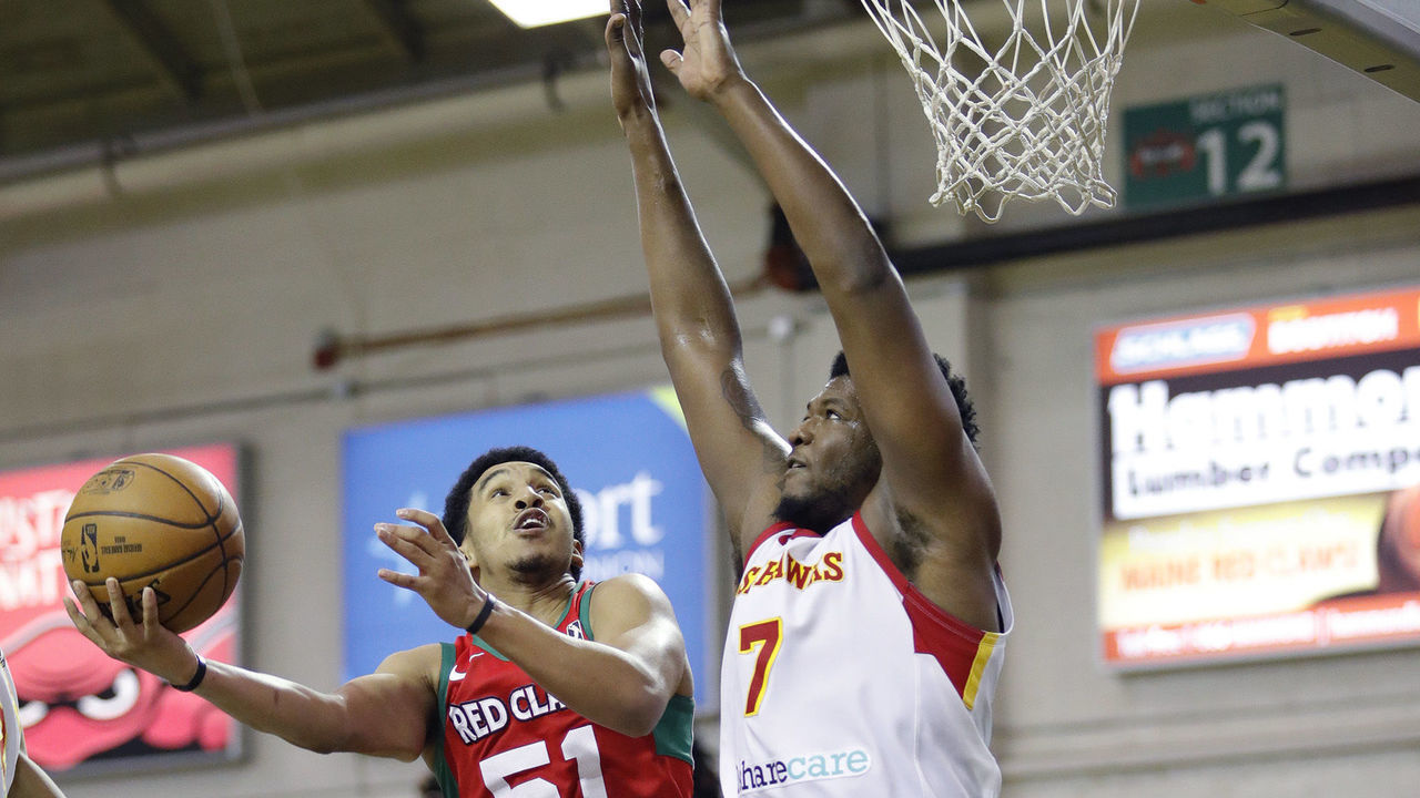 PORTLAND, ME - DECEMBER 29: Maine Red Claws' Tremont Waters, left, goes up for a shot while being guarded by College Park Skyhawks Marcus Derrickson, right, during the third period of their game Sunday, Dec. 29, 2019 in Portland, Maine. (Staff Photo by Joel Page/Portland Press Herald via Getty Images)