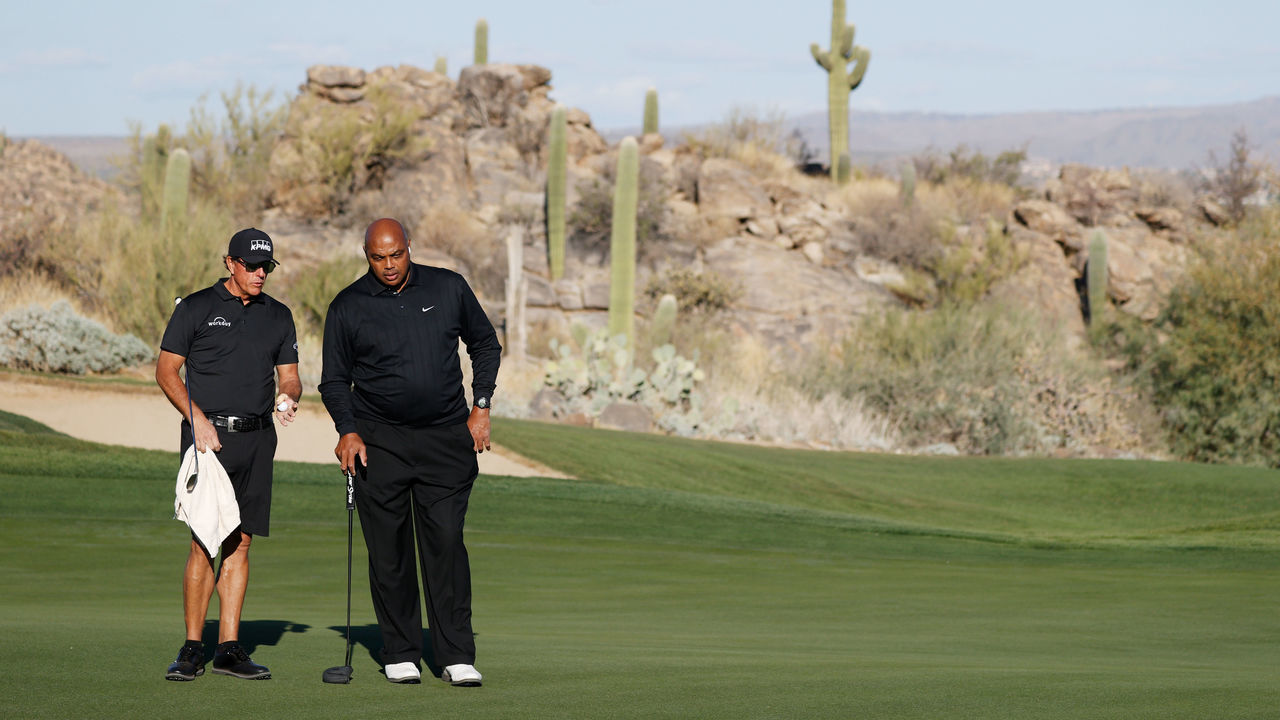 TUCSON, ARIZONA - NOVEMBER 27: Phil Mickelson and Charles Barkley talk on the eighth green during Capital One's The Match: Champions For Change at Stone Canyon Golf Club on November 27, 2020 in Oro Valley, Arizona.
