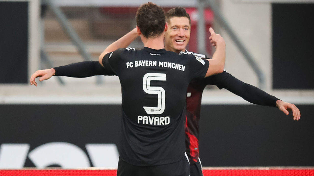 28 November 2020, Baden-Wuerttemberg, Stuttgart: Football: Bundesliga, VfB Stuttgart - Bayern Munich, 9th matchday, Mercedes-Benz Arena. Munich's Robert Lewandowski (r) cheers after his goal for the 1:2 with Benjamin Pavard. Photo: Tom Weller/dpa - IMPORTANT NOTE: In accordance with the regulations of the DFL Deutsche Fußball Liga and the DFB Deutscher Fußball-Bund, it is prohibited to exploit or have exploited in the stadium and/or from the game taken photographs in the form of sequence images and/or video-like photo series.