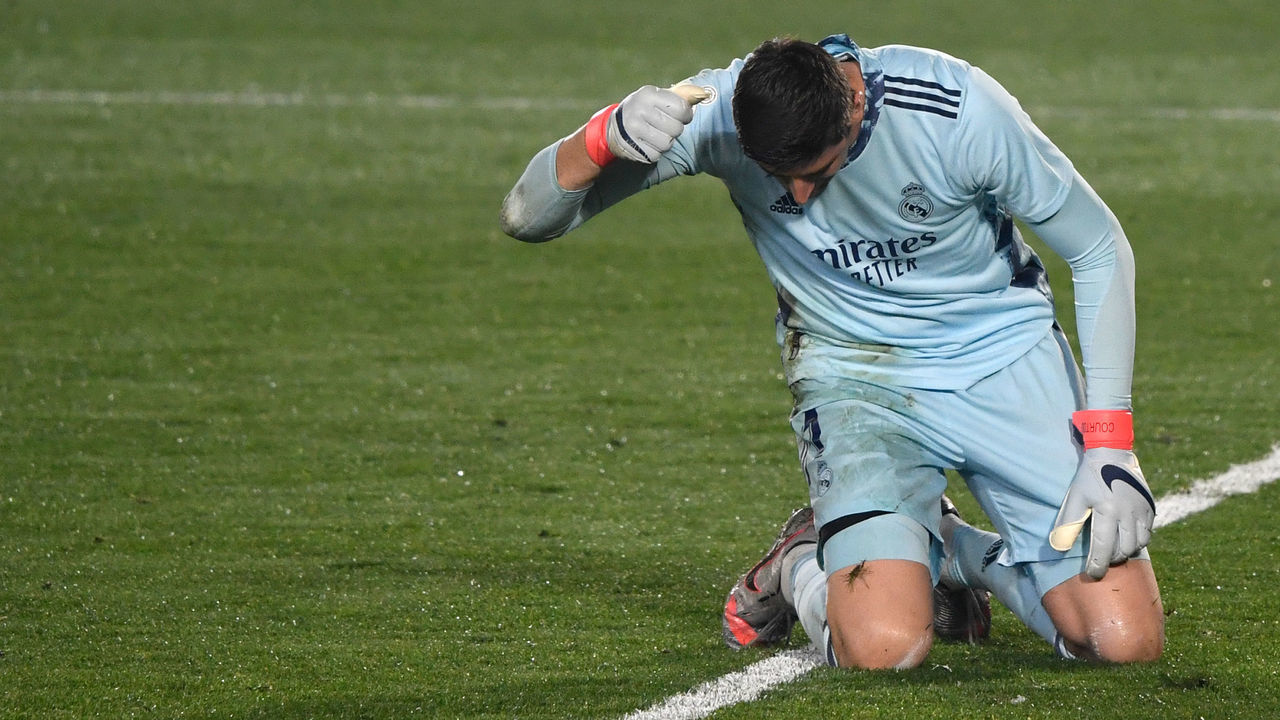 Real Madrid's Belgian goalkeeper Thibaut Courtois reacts hitting the field to Alaves' Spanish forward Joselu's goal during the Spanish League football match between Real Madrid and Deportivo Alaves at the Alfredo Di Stefano stadium in Madrid, on November 28, 2020.