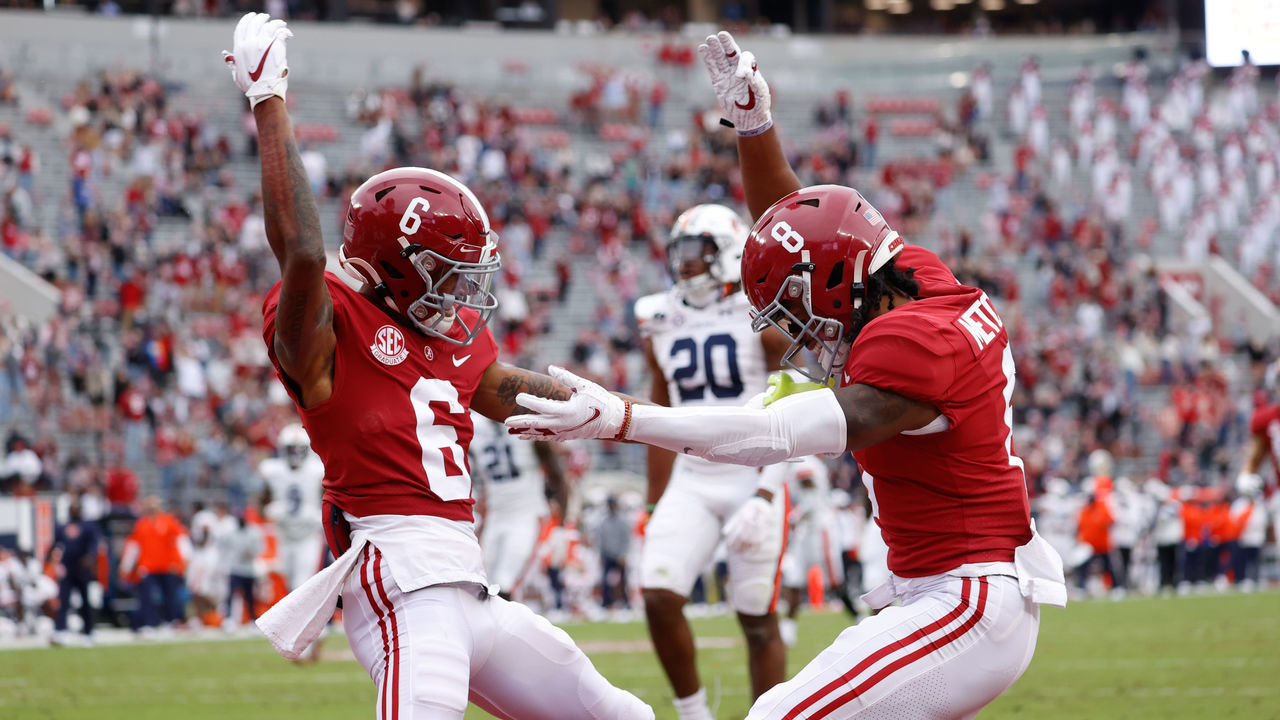 TUSCALOOSA, AL - NOVEMBER 28: Devonta Smith #6 and John Metchie III of the Alabama Crimson Tide celebrate scoring a touchdown against the Auburn Tigers at Bryant-Denny Stadium on November 28, 2020 in Tuscaloosa, Alabama.