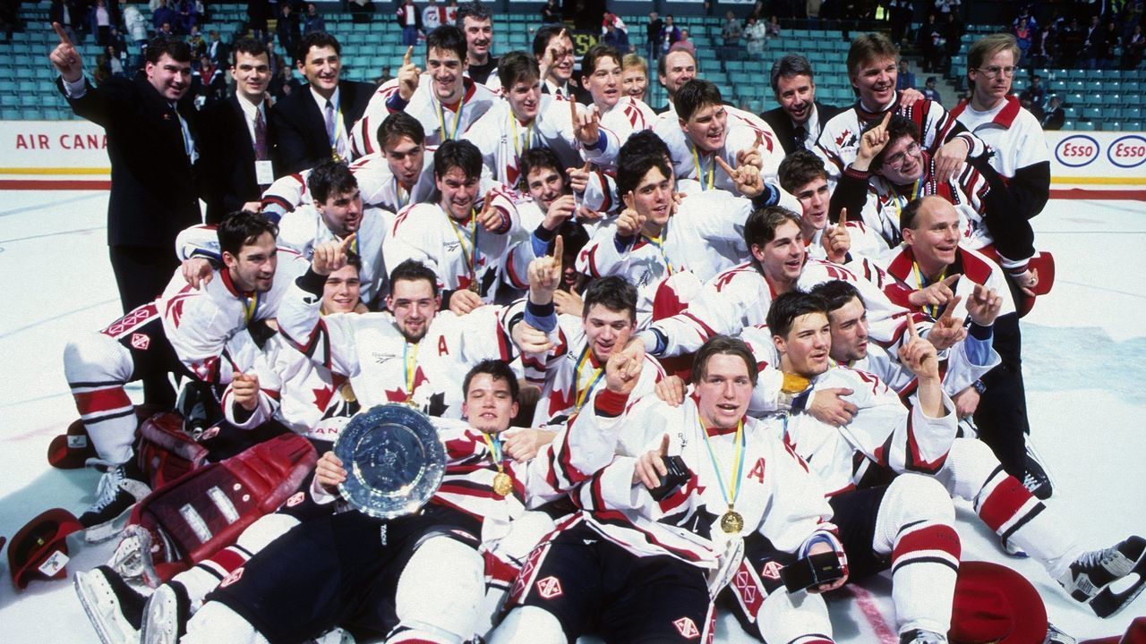 RED DEER. ALBERTA - 1995: Team Canada poses for a team photo with their Gold Medals after winning their third strait World Junior Ice Hockey Championships circa December 26, 1994 through January 4, 1995 in Red Deer, Alberta, Canada.