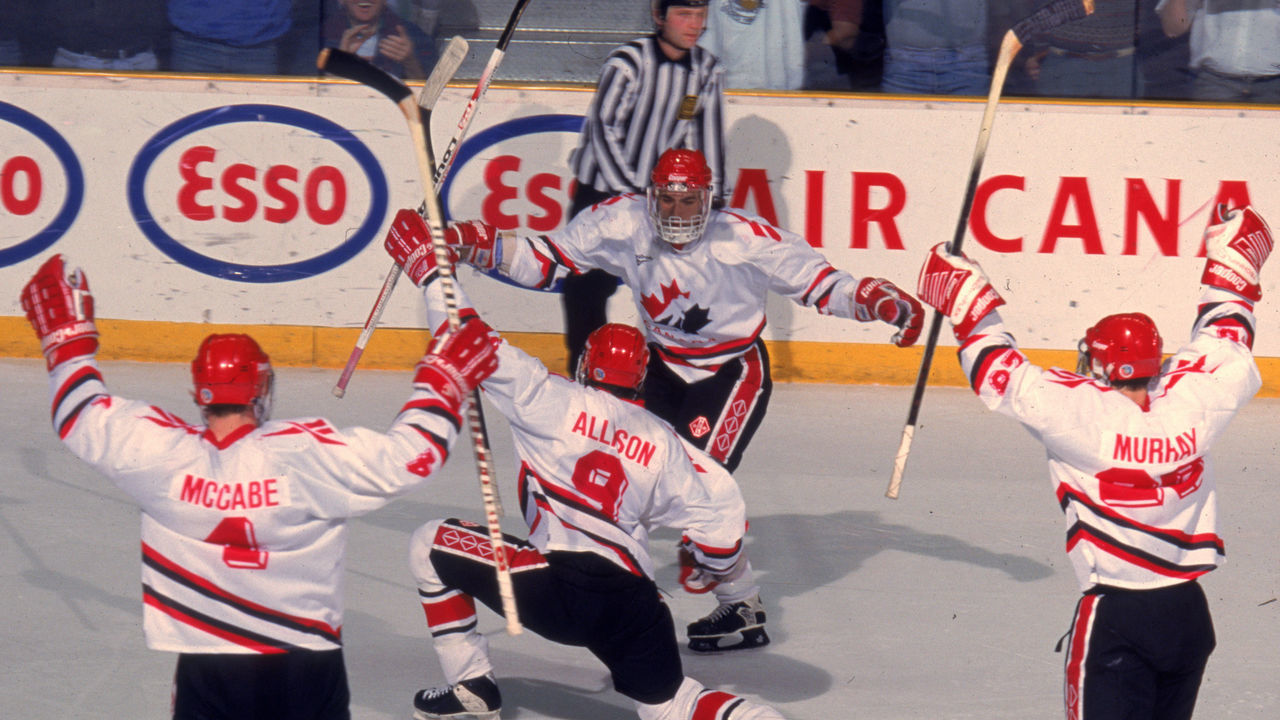 Team Canada celebrates during a game at the 1995 World Junior Championships, where Team Canada won the gold medal, Alberta, Canada, December 1995. Visible players include Canadians Bryan McCabe, Jason Allison, and Marty Murray.