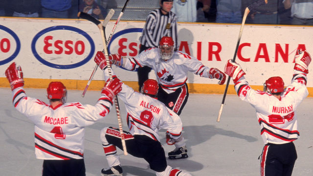 Team Canada celebrates during a game at the 1995 World Junior Championships, where Team Canada won the gold medal, Alberta, Canada, December 1995. Visible players include Canadians Bryan McCabe, Jason Allison, and Marty Murray.